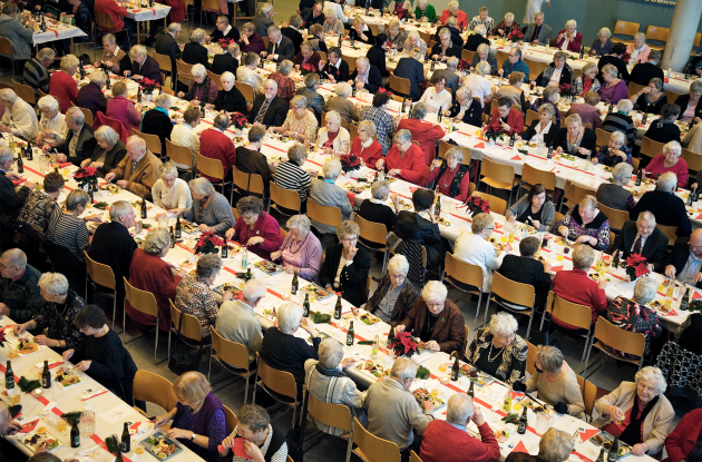 Large lunch table with senior citizens