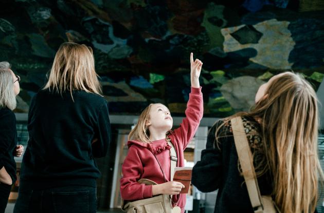 Girl pointing at ceiling