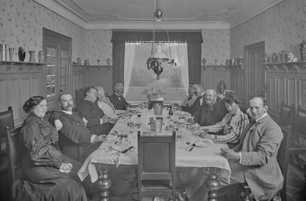 Guests for dinner at a well-spread table