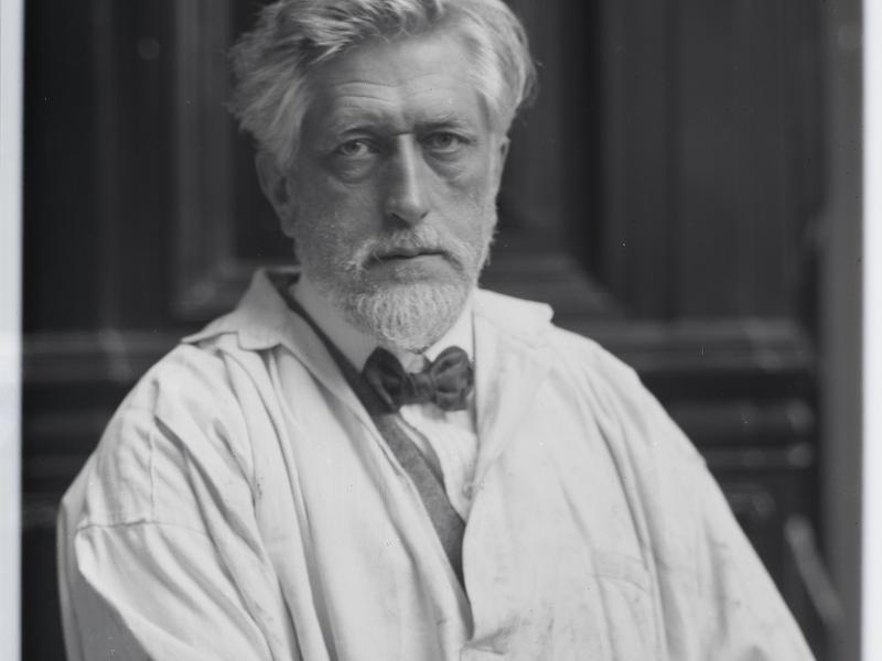 Man wearing white coat and bow tie